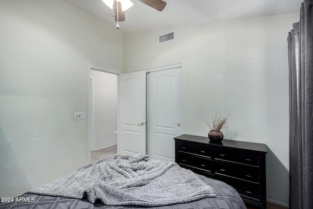 bedroom with ceiling fan and a closet