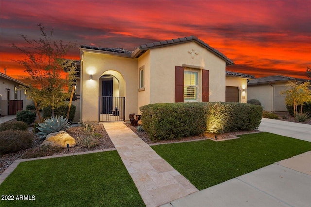 29344 N 132nd Ln, Peoria, AZ 85383 - mediterranean / spanish-style house with an attached garage, stucco siding, and a tiled roof