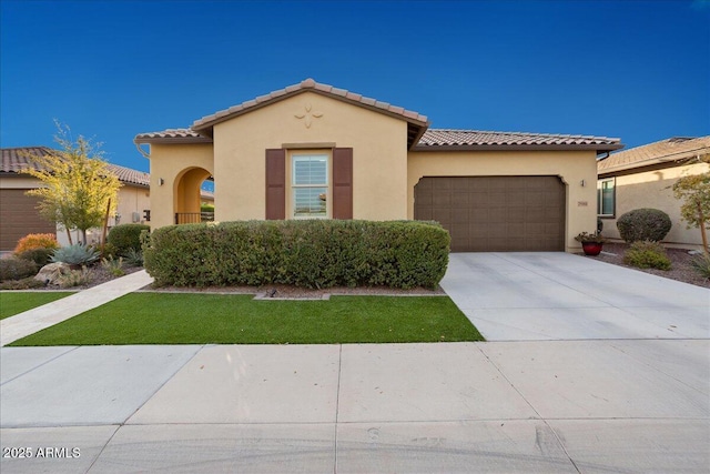 29344 N 132nd Ln, Peoria, AZ 85383 - mediterranean / spanish-style home featuring an attached garage, a tile roof, and stucco siding