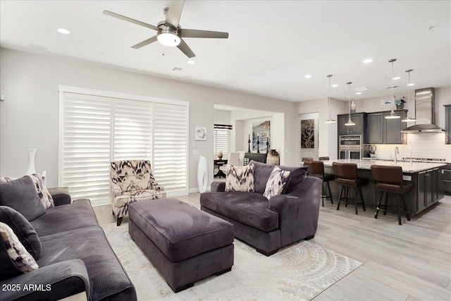 29344 N 132nd Ln, Peoria, AZ 85383 - living room featuring light wood-style floors, a ceiling fan, and recessed lighting