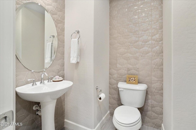 29344 N 132nd Ln, Peoria, AZ 85383 - half bath featuring tile walls, toilet, and decorative backsplash
