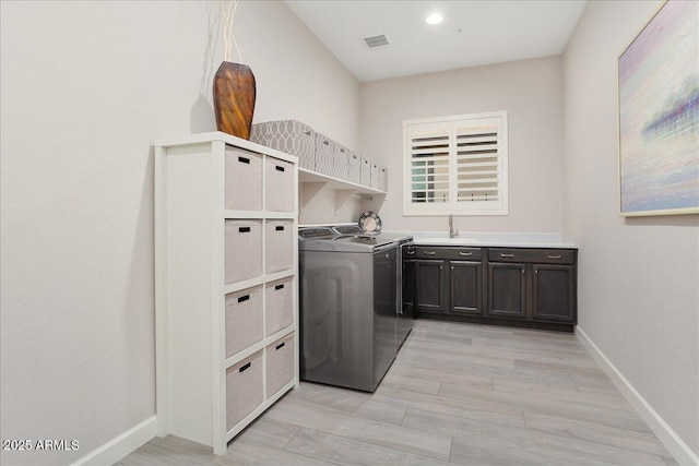 29344 N 132nd Ln, Peoria, AZ 85383 - laundry area featuring cabinet space, washing machine and dryer, baseboards, light wood-style flooring, and recessed lighting