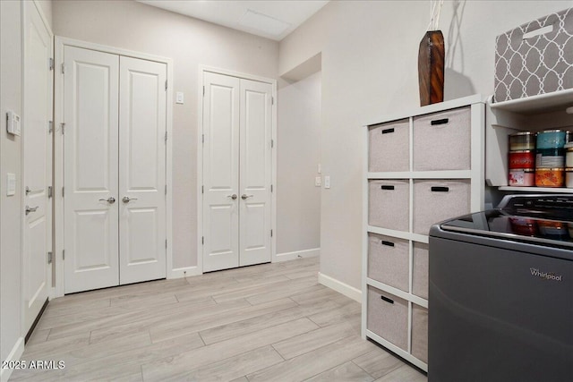 29344 N 132nd Ln, Peoria, AZ 85383 - washroom featuring washer / clothes dryer, light wood finished floors, and baseboards