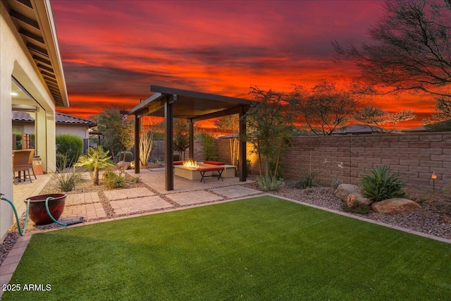 29344 N 132nd Ln, Peoria, AZ 85383 - yard at dusk featuring a fire pit and a patio