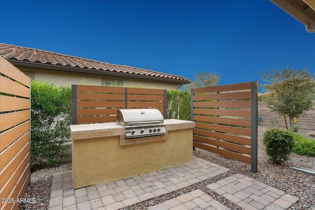 29344 N 132nd Ln, Peoria, AZ 85383 - view of patio with a grill, exterior kitchen, and fence