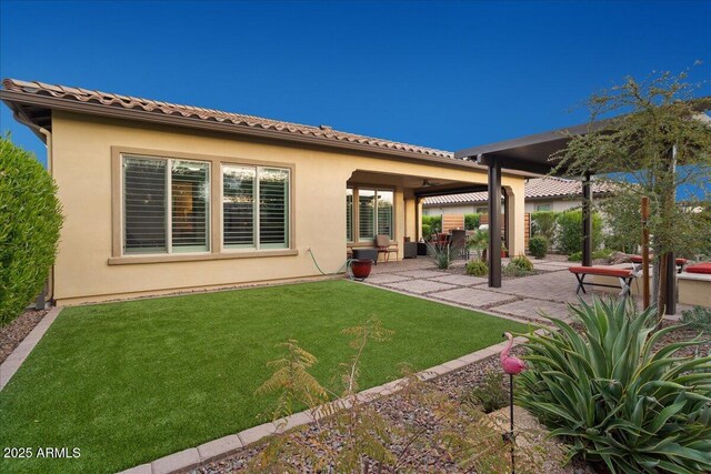 29344 N 132nd Ln, Peoria, AZ 85383 - back of property with a patio, stucco siding, and a yard