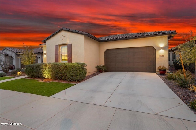 29344 N 132nd Ln, Peoria, AZ 85383 - mediterranean / spanish home with a tile roof, stucco siding, driveway, and a garage
