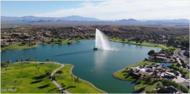 drone / aerial view with a water and mountain view