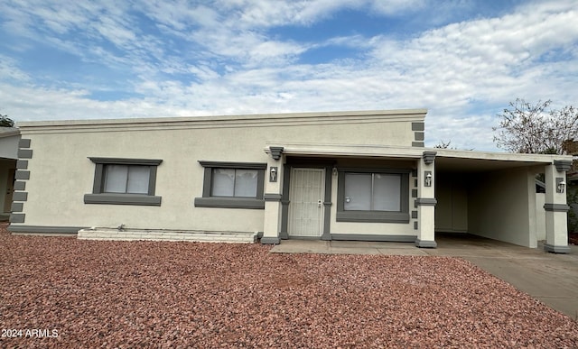 view of front of house featuring a carport