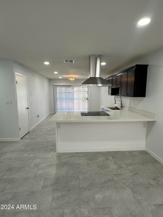 kitchen with sink, dark brown cabinets, kitchen peninsula, light tile patterned floors, and range hood