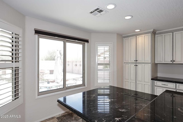 dining room with recessed lighting and baseboards