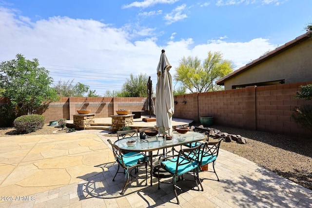 view of patio / terrace featuring a fenced backyard and outdoor dining space