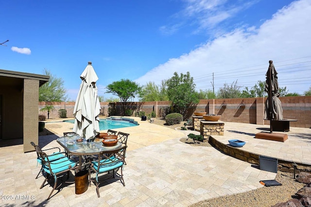 view of patio / terrace featuring a fenced backyard and outdoor dining area