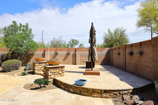 view of patio featuring a fenced backyard