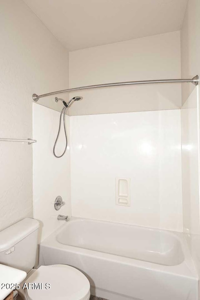 bathroom with toilet and shower / tub combination