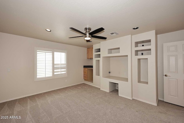 unfurnished bedroom with light carpet, baseboards, recessed lighting, and ceiling fan