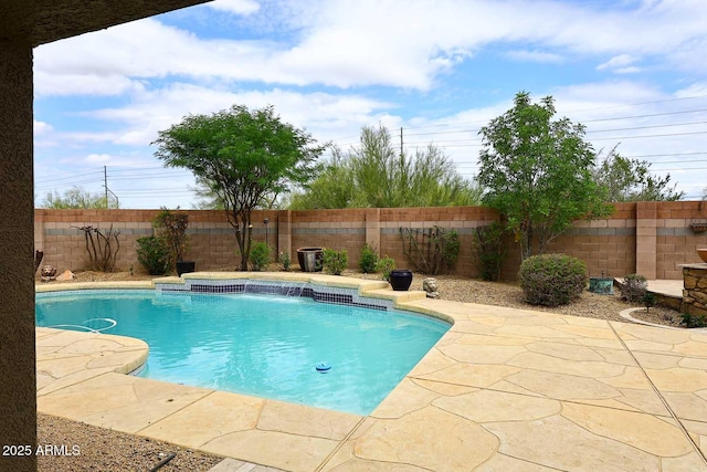view of pool with a fenced backyard and a patio area