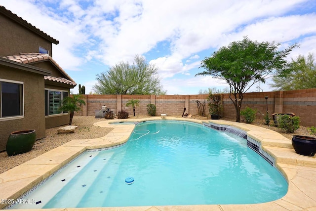 view of swimming pool featuring a fenced backyard