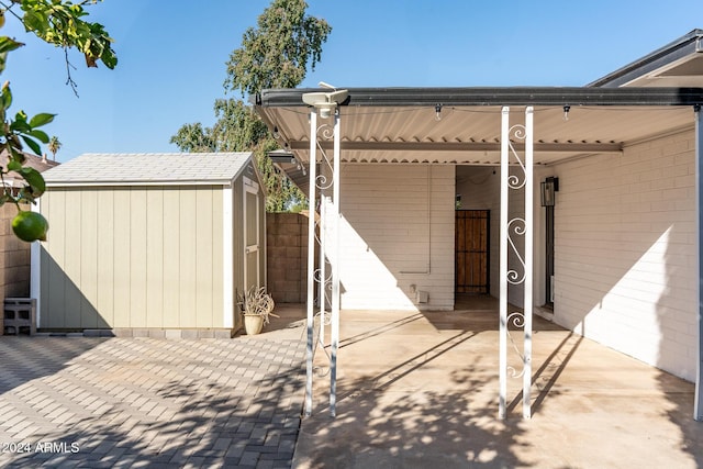 view of patio with a storage shed