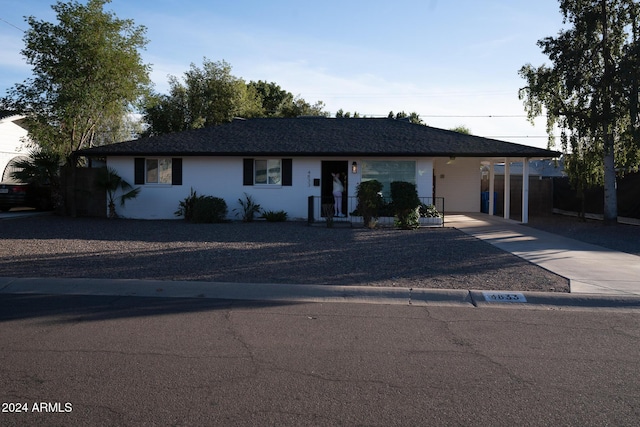 ranch-style house with a carport