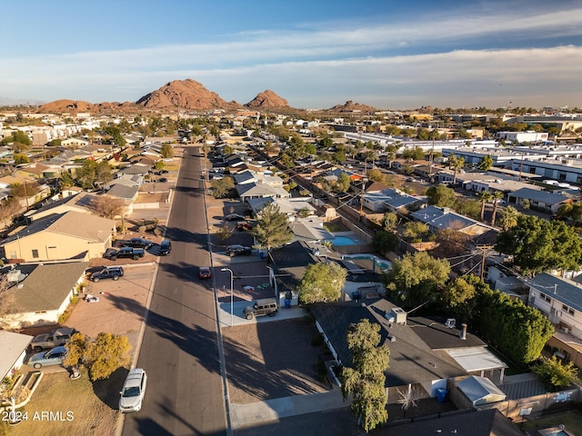 birds eye view of property with a mountain view