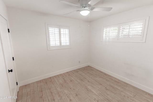 empty room featuring ceiling fan and light hardwood / wood-style flooring