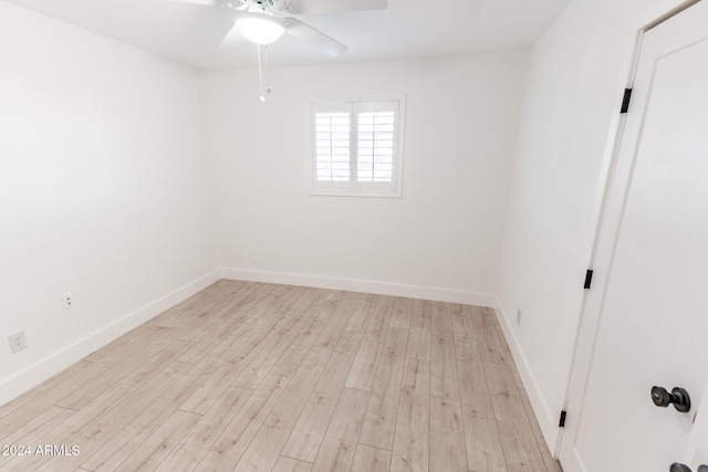 empty room featuring light wood-type flooring and ceiling fan