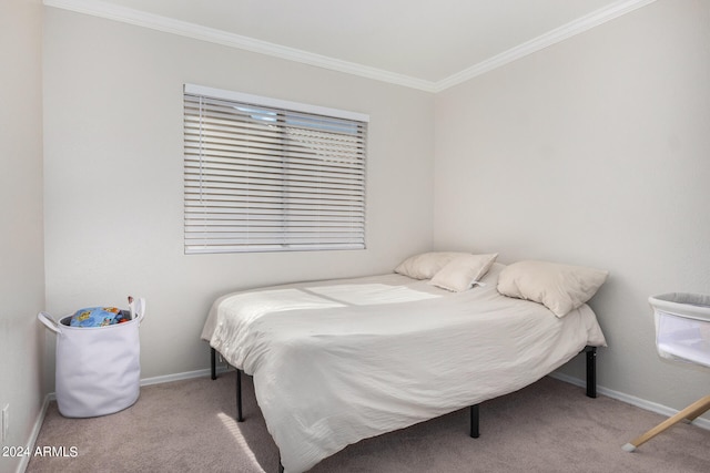 carpeted bedroom featuring crown molding