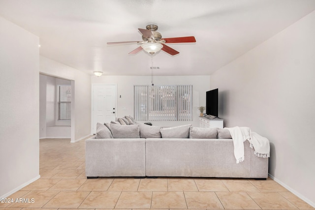 living room with ceiling fan and light tile patterned floors