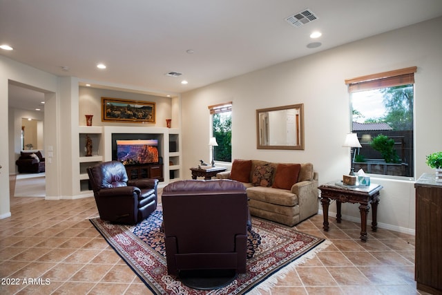 living room featuring visible vents, recessed lighting, and plenty of natural light