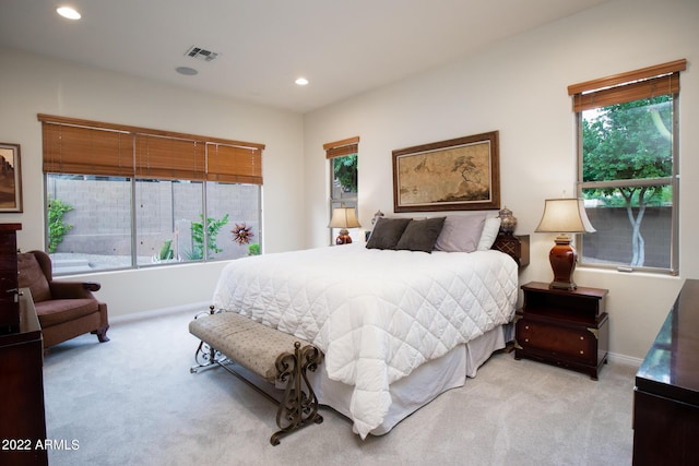 carpeted bedroom with recessed lighting, baseboards, and visible vents