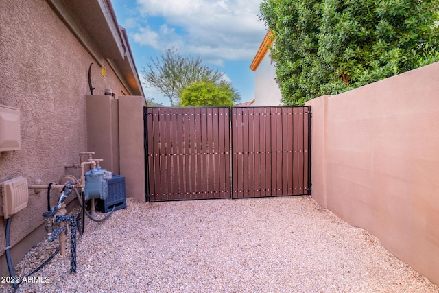 view of gate featuring fence