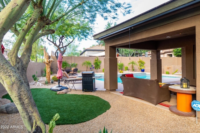 view of yard with a fenced in pool, a patio, and a fenced backyard