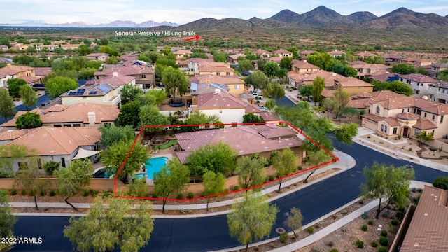 bird's eye view with a residential view and a mountain view