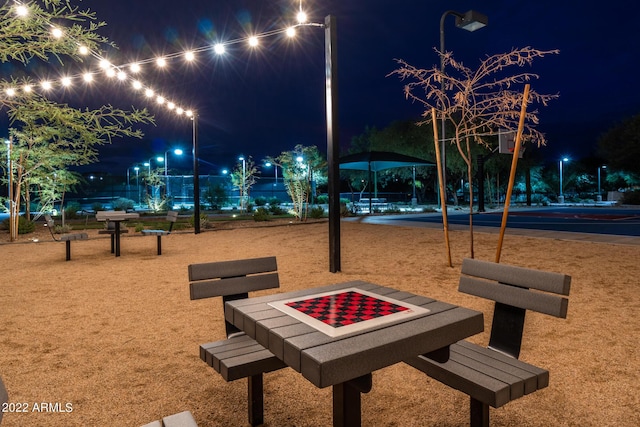 view of community with an outdoor fire pit