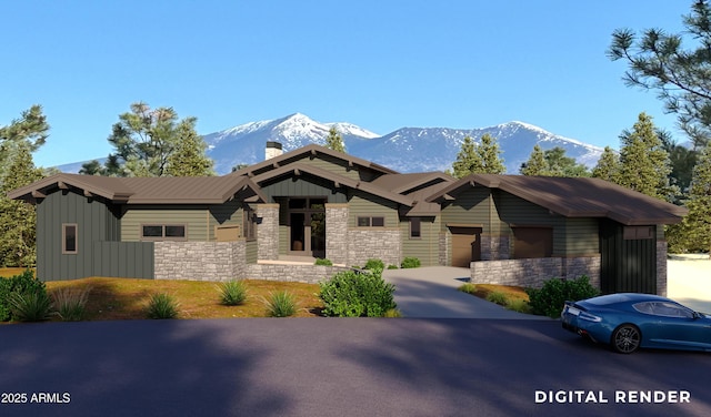 view of front of home featuring a mountain view and a garage