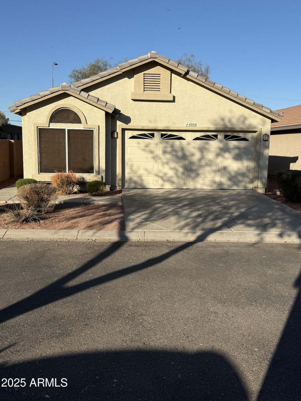 single story home with a garage