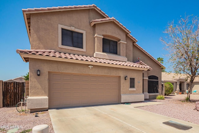 9646 N 94th Ave, Peoria, AZ 85345 - mediterranean / spanish-style home with a tile roof, stucco siding, and a garage