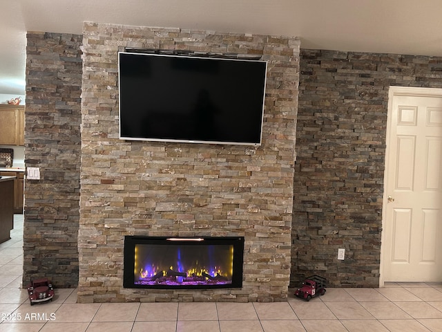 interior details featuring a stone fireplace