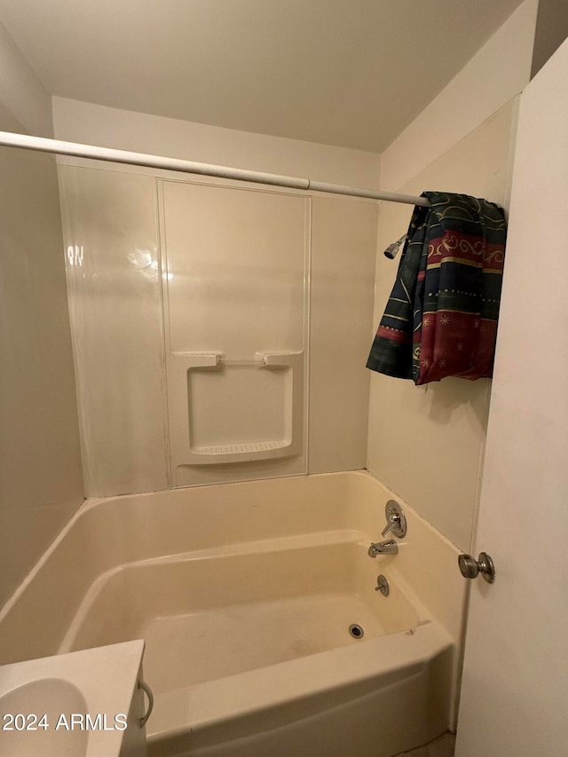 bathroom with vanity and  shower combination