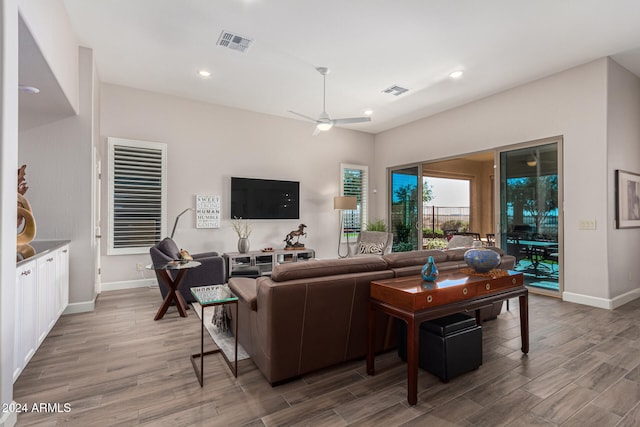 living room with ceiling fan and hardwood / wood-style flooring