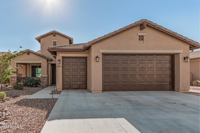 view of front of property with a garage