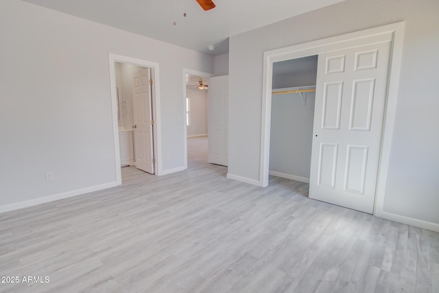 unfurnished bedroom with ceiling fan, baseboards, light wood-type flooring, a closet, and ensuite bath