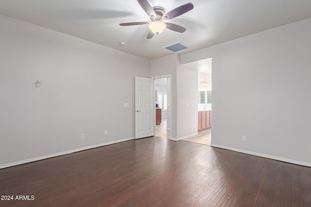 empty room with hardwood / wood-style flooring and ceiling fan