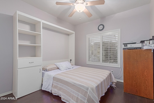 bedroom featuring ceiling fan and dark hardwood / wood-style flooring