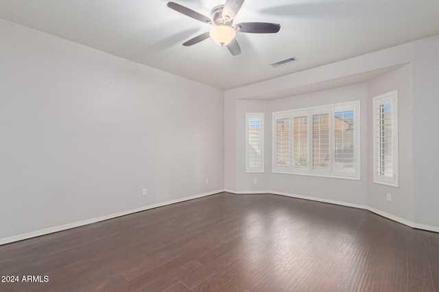 unfurnished room featuring dark hardwood / wood-style flooring and ceiling fan