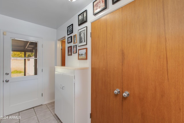 corridor featuring light tile patterned flooring