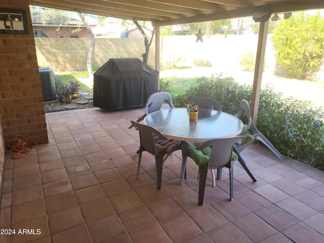 view of patio with grilling area and central air condition unit