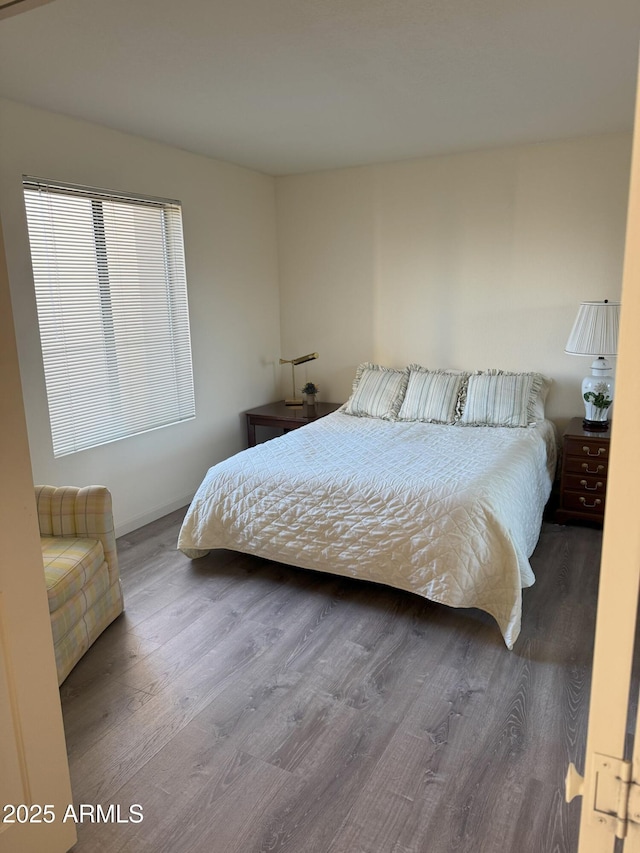 bedroom featuring wood finished floors