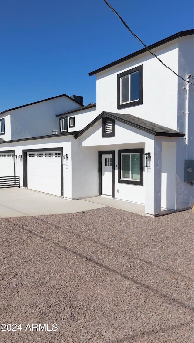 view of front of property with a garage